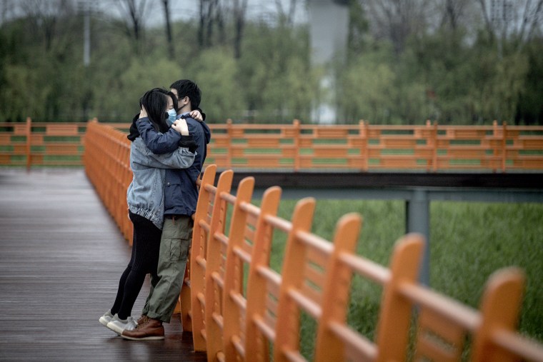 Image: A couple hug in Wuhan