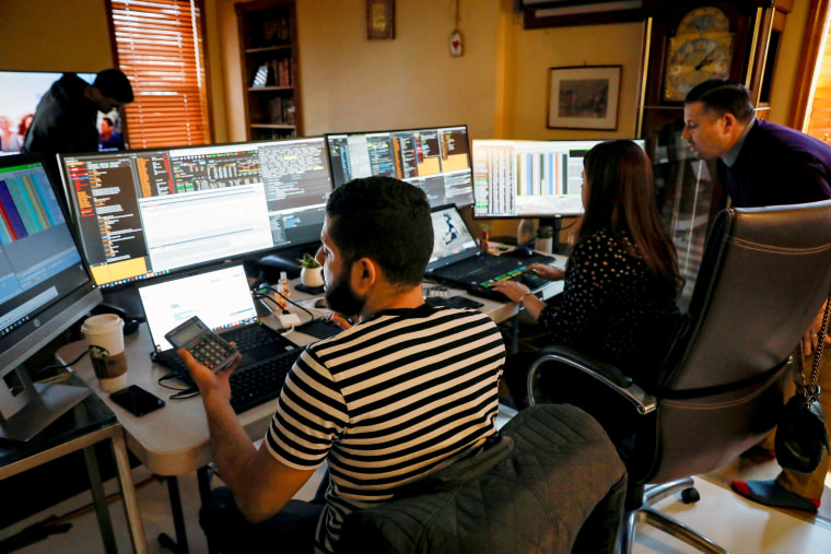 Image: NYSE-AMEX Options floor traders from TradeMas Inc. work in an off-site trading office  due to the outbreak of the coronavirus disease (COVID-19), in New York