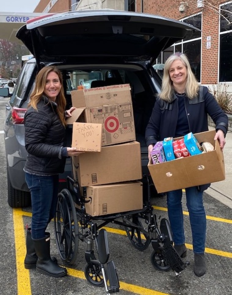 Liz Bernich with her partner, Gina McGuire, making a food drop-off at the Morristown Medical Center emergency room.