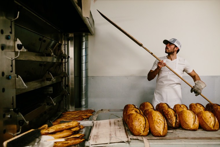Chef Ismael de Sousa of Reunion Bread in Denver, Colorado, has been busy baking extra loaves that the bakery is giving away to those in need. 