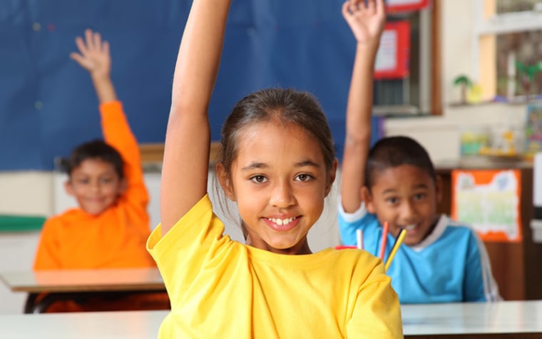 kids raising hands