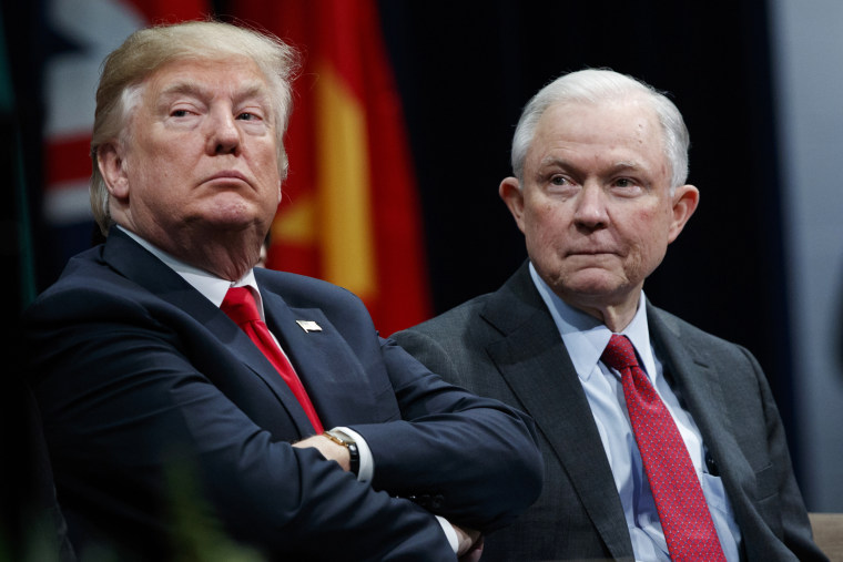 Image: President Donald Trump, left, sits with Attorney General Jeff Session