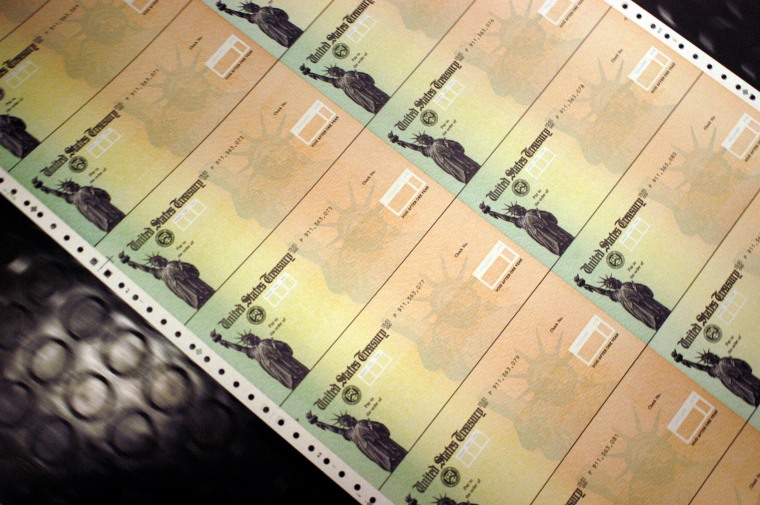 Image: Checks run through the printer at the U.S. Treasury printing facility in Philadelphia in 2005.