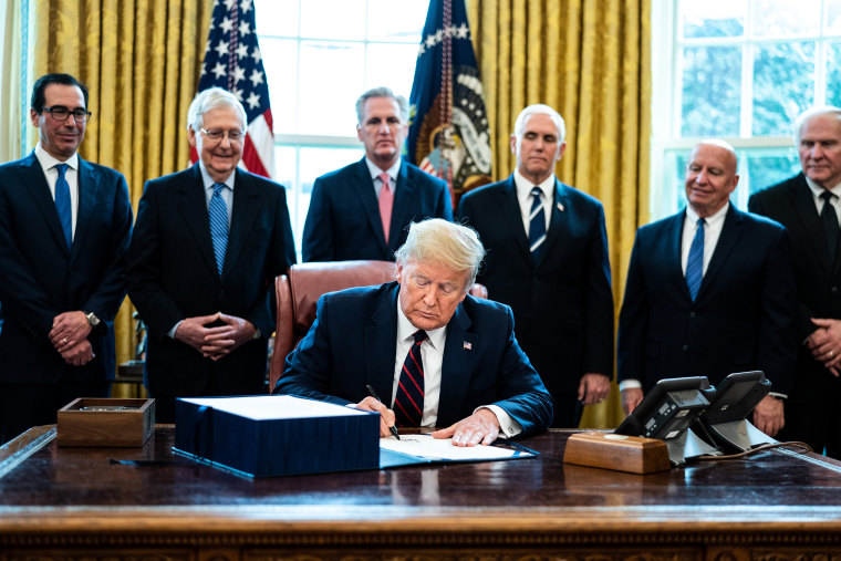 Image: President Trump Signs Coronavirus Stimulus Bill In The Oval Office
