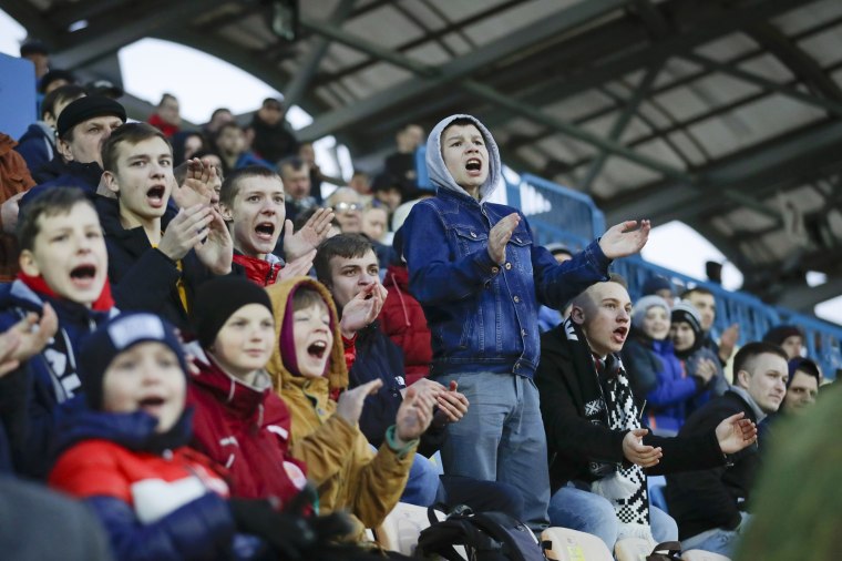 Young fans react during a Belarus soccer match on March 27. Longtime Belarus President Alexander Lukashenko is proudly keeping soccer and hockey arenas open even though most sports around the world have shut down because of the coronavirus pandemic.