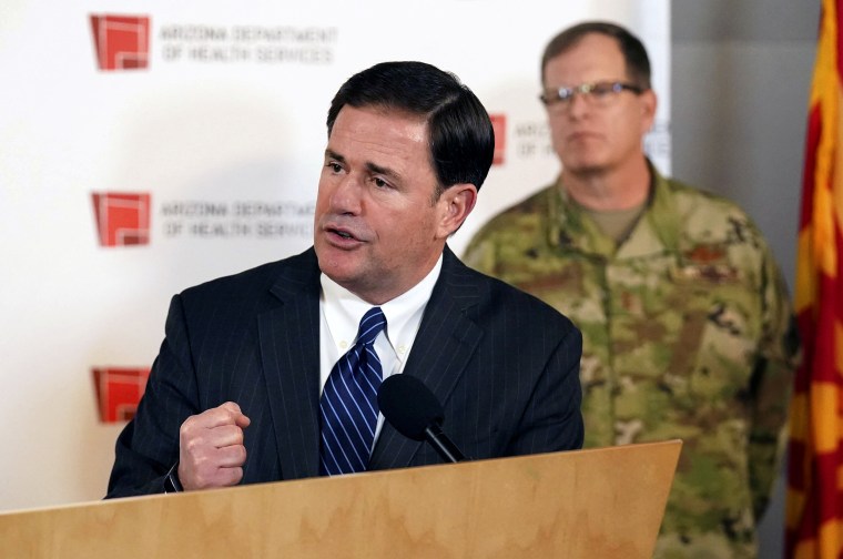 Image: Arizona Governor Doug Ducey holds a press conference on coronavirus in Phoenix on March 25, 2020.