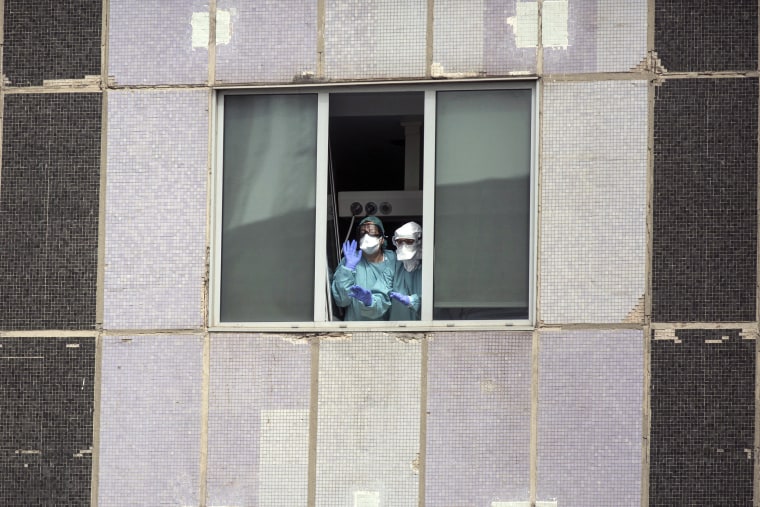 Image: Medical workers at La Paz hospital in Madrid