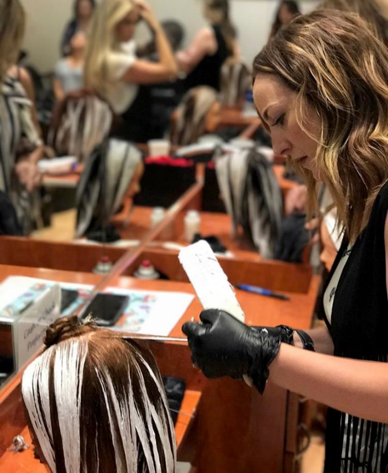 Image: Leslie Leach practices coloring techniques at a Gilbert, Ariz., salon in 2019. Leach closed down her own salon in Chandler this month because of her concerns about the coronavirus.