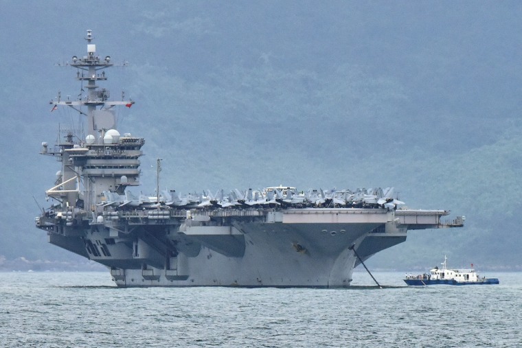 Image: The aircraft carrier Theodore Roosevelt is pictured as it enters the port in Da Nang, Vietnam