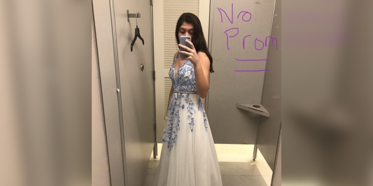 Shannon Funk, a senior at Maur Hill in Atchison, KS, in her high school prom dress that she will not be able to wear.