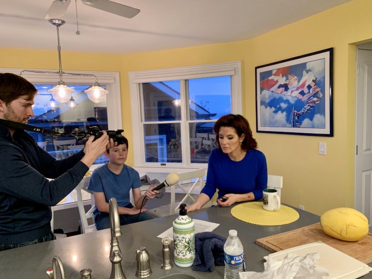 MSNBC anchor Stephanie Ruhle's producer Michael Cappetta and son Reese helping her shoot at home. 
