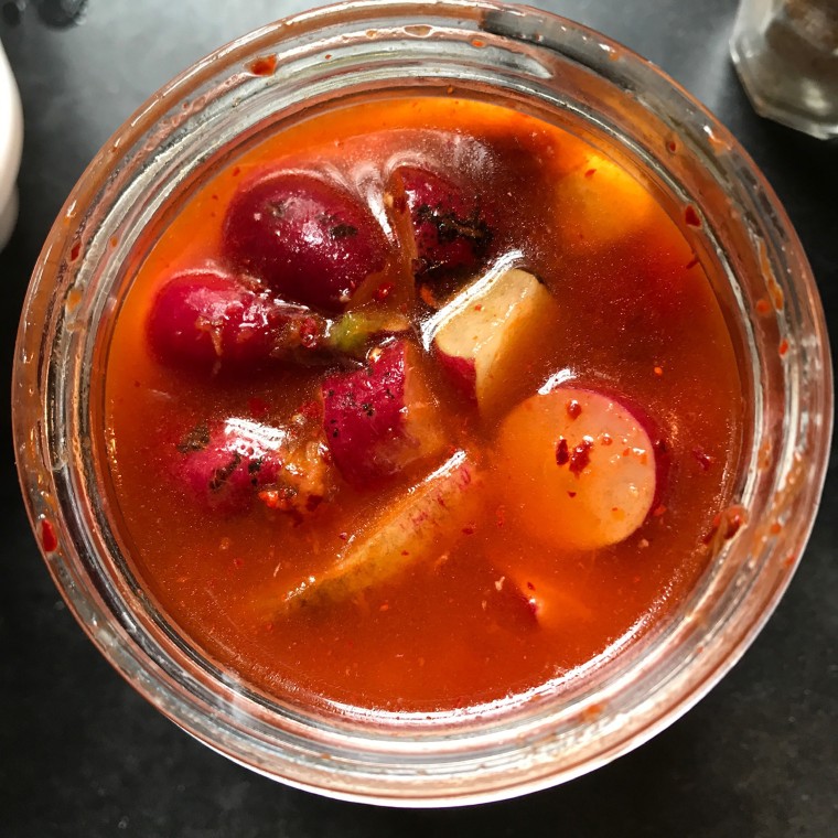 Mom's early morning radish-pickling in action.