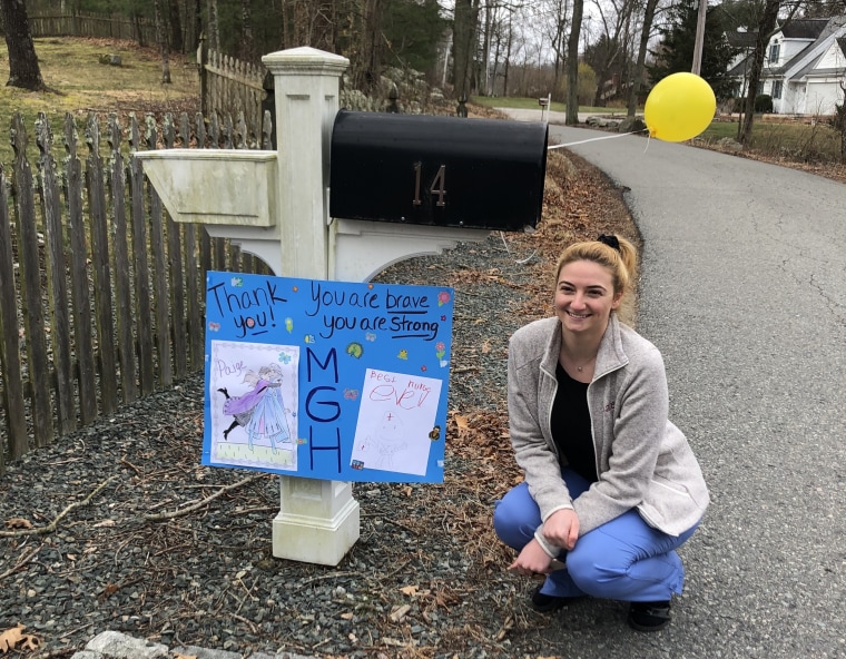 23-year-old nurse Paige Colombo returned home from a 12-hour shift last week to find her neighbors had lined the street with signs thanking her for keeping their community safe.