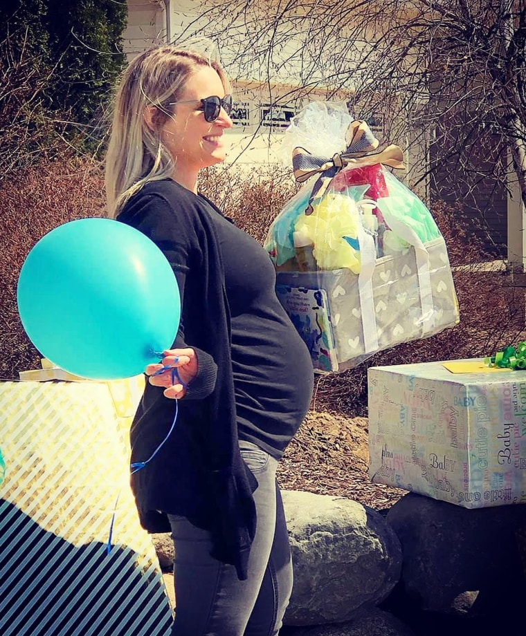 Lindsey Elliott's baby shower was supposed to be April 5, but coronavirus meant it was canceled. She felt stunned to see her friends and family have a drive-by baby shower for her. 