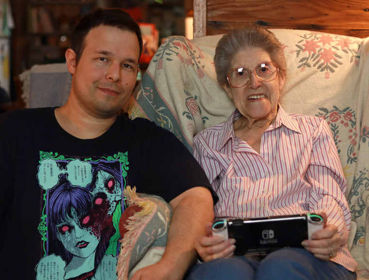 Video game designer Paul Hubans with his grandmother, Audrey Buchanan, who has played nearly 4,000 hours of Nintendo's "Animal Crossing" video games.