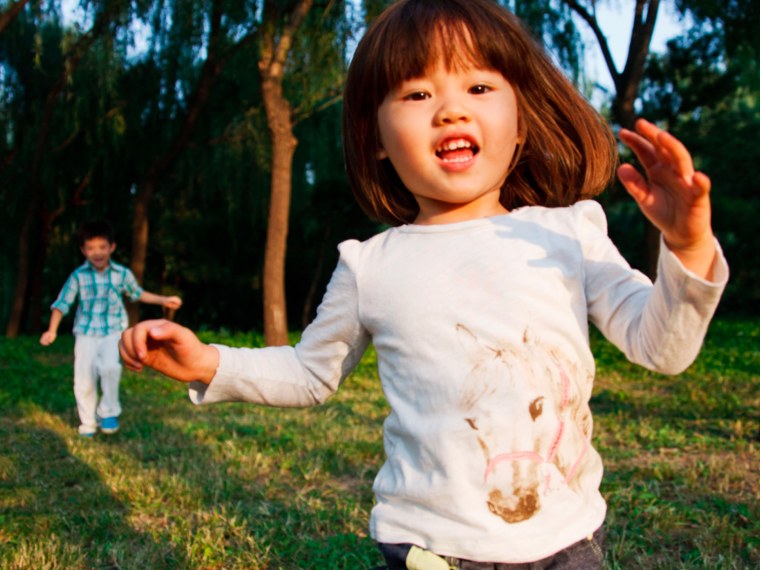 Young girl running outside.