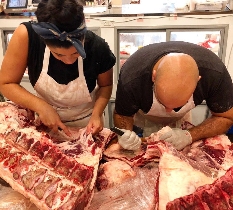 Nicoletti with her colleague, Pete, at Foster Sundry butcher shop in Brooklyn, New York.