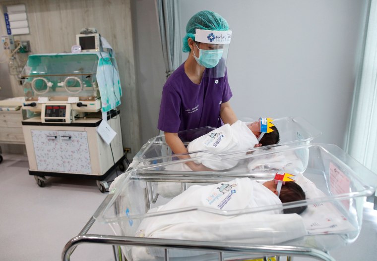 Newborn baby wear face shield to prevent the COVID-19 coronavirus pandemic, Samut Prakan, Thailand - 08 Apr 2020