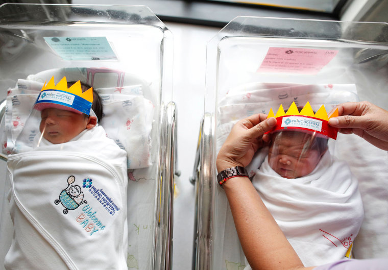 Newborn baby wear face shield to prevent the COVID-19 coronavirus pandemic, Samut Prakan, Thailand - 08 Apr 2020