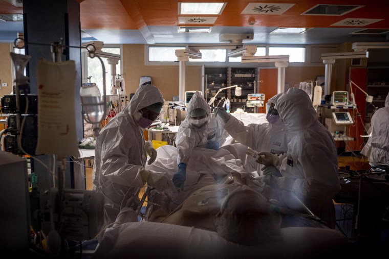 Image: Doctors treat COVID-19 patients in an intensive care unit at the third Covid 3 Hospital (Istituto clinico CasalPalocco) during the Coronavirus emergency on March 26, 2020, in Rome, Italy.