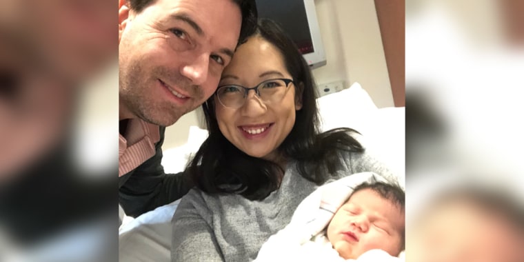 Dr. Leana Wen, Baltimore's former health commissioner, with husband Sebastian Walker and their newborn daughter,  Isabelle Wen Walker. 