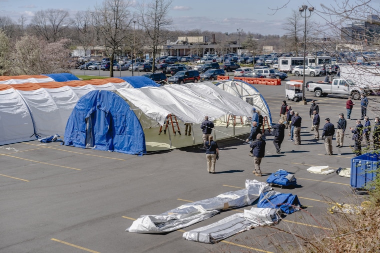 Image: Emergency tents are assembled in the parking lot of the North Shore University Hospital in Manhasset, N.Y., April 1, 2020. (Johnny Milano/The New York Times)