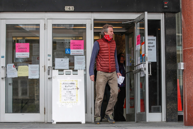 Image: A man leaves the Frank P. Zeidler Municipal Building after not being able to cast his ballot at the already closed drop-off site in Milwaukee, Wisconsin