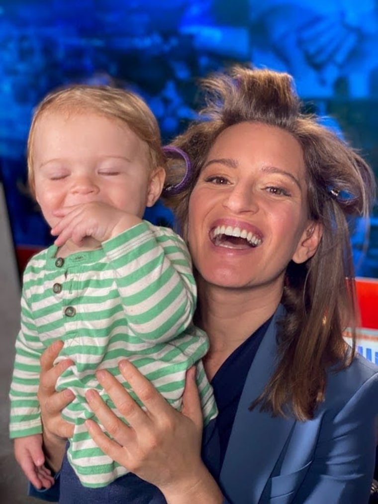 "MSNBC Live" anchor and NBC News correspondent Katy Tur holding her son Teddy before she goes on air. 
