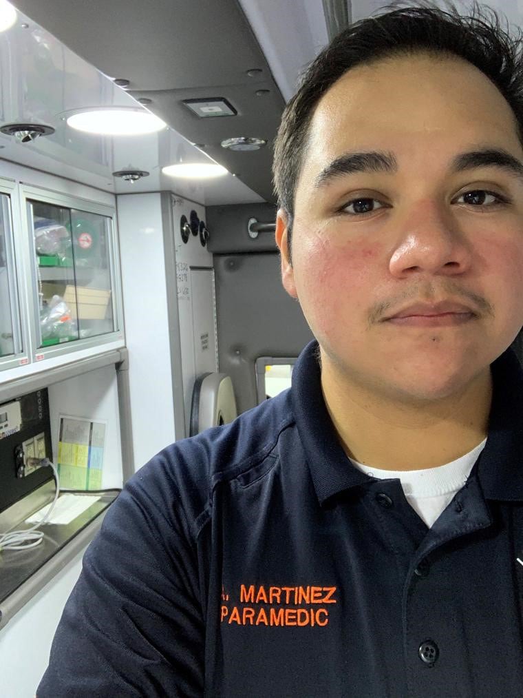 Aldo Martinez works as a paramedic in Fort Myers, Florida, as the number of emergency calls regarding patients with viral symptoms has increased.