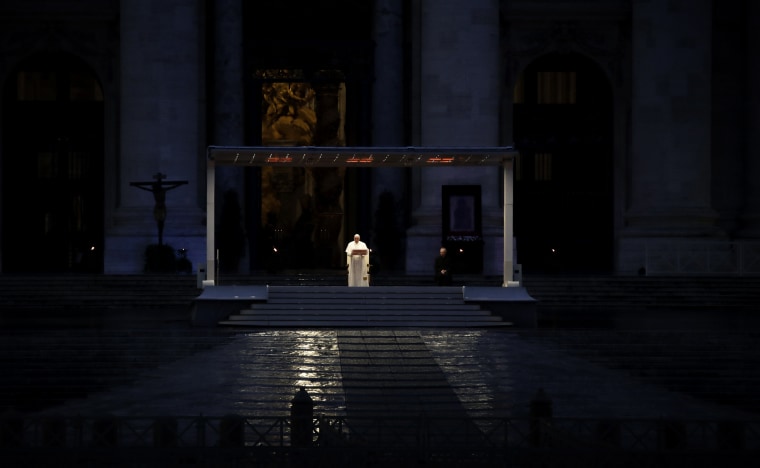 Image: Pope Francis delivers prayers in an empty St. Peter's Square at the Vatican on March 27, 2020.