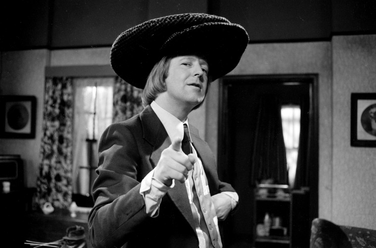 Image: Tim Brooke-Taylor in an episode of the BBC series \"The Goodies\" in 1975.