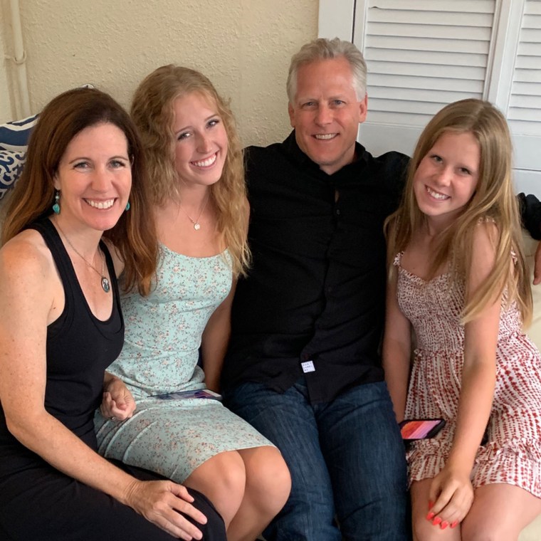 Cartoonist Adrienne Hedger with her husband, Jack, and their daughters Kate and Claire.