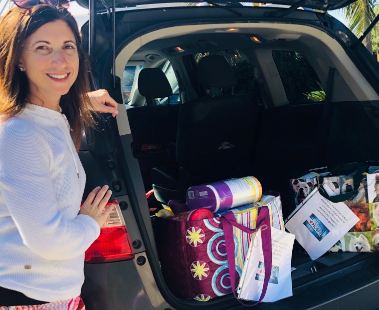 Rebecca Talaia, a sixth grade teacher in Indialantic, Florida, with the first donation of disinfectant wipes she collected from the school where she works.