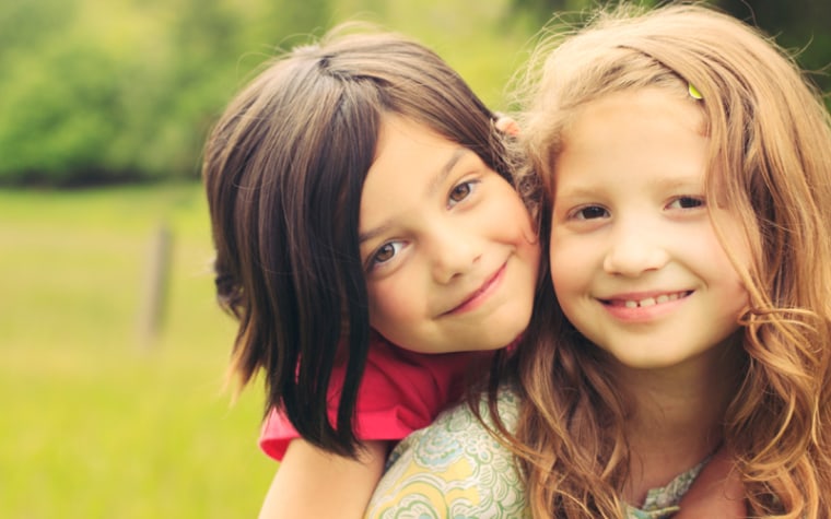 Two girls smile