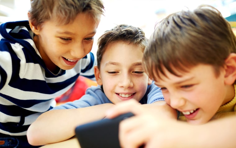 boys looking at phone