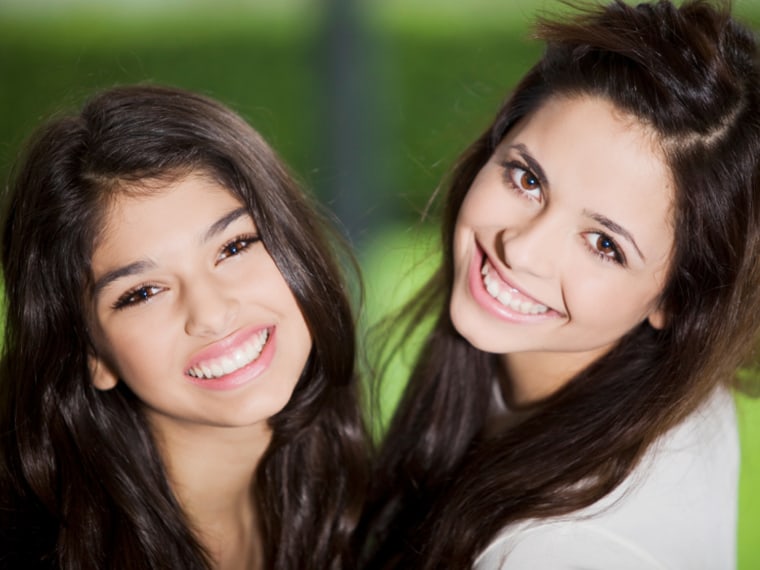 Two brunette girls smiling
