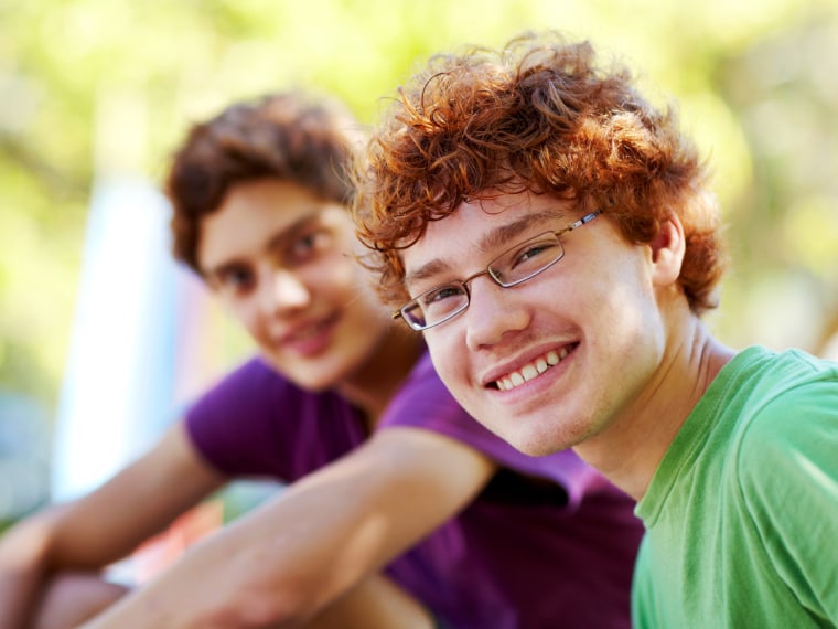 Red head teen boy with glasses