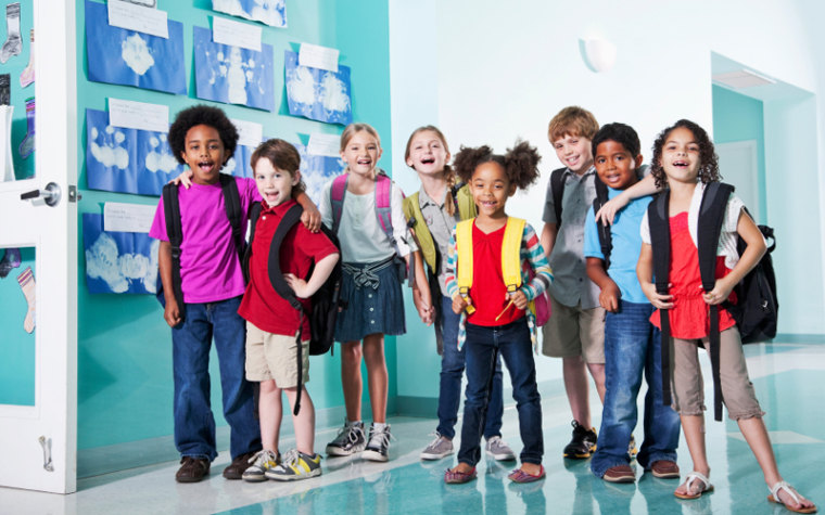 Group of young kids in a school hallway