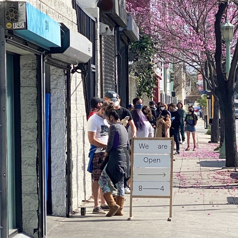 Out-of-work hospitality professionals lined up to receive their meals outside Sqirl in Los Angeles' Silver Lake neighborhood.