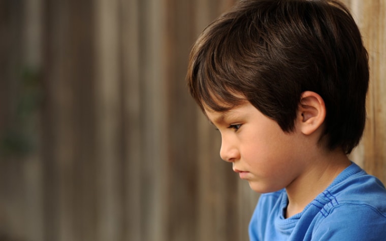 Profile of boy looking down