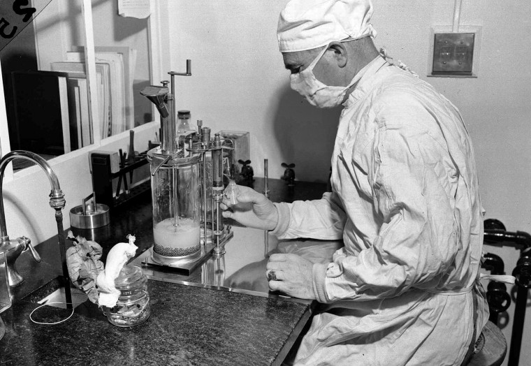 Charles D. Brown fills a vial with the BCG tuberculosis vaccine at a state-operated laboratory in Albany, N.Y., on Dec. 2, 1947.