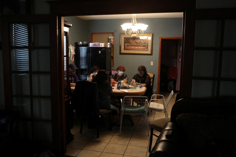 Image: Family members of JBS USA meat packing plant employee Saul Sanchez gather at his home in Greeley