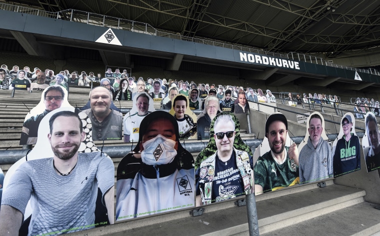 Image: Fan portraits are set on the supporters tribune of German Bundesliga soccer club Borussia Moenchengladbach at the stadium in Moenchengladbach, Germany