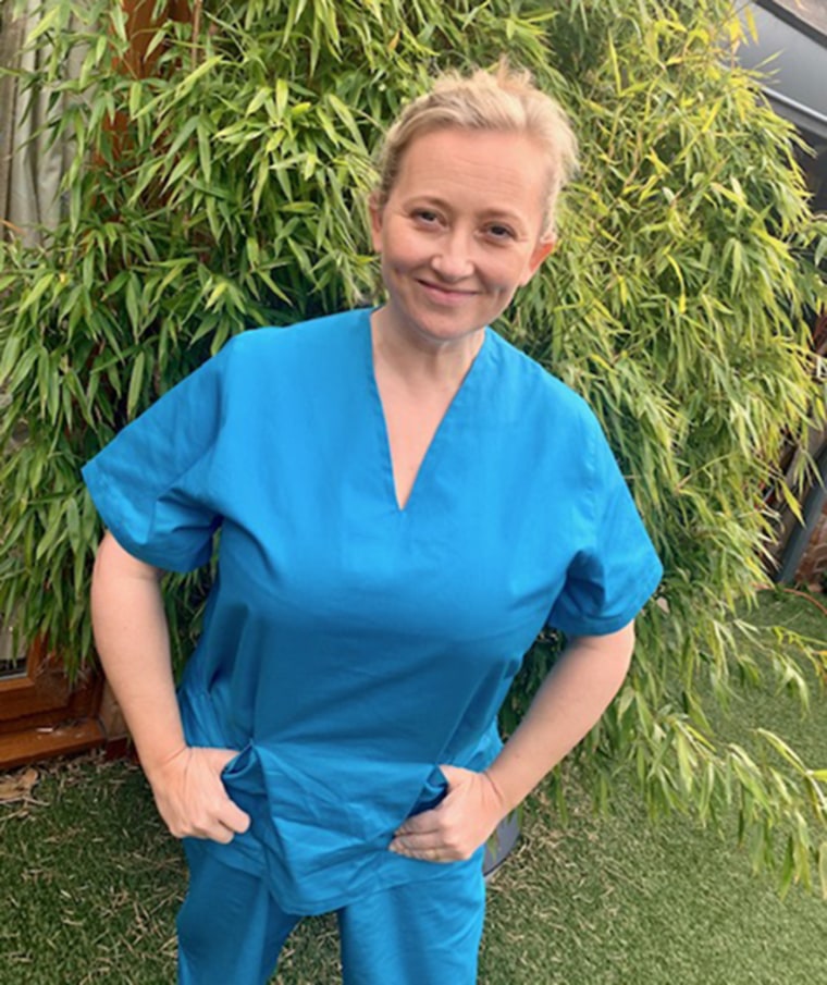 Image: Nurse Tara Parker wearing a pair of the finished scrubs made by the team of costume designers.