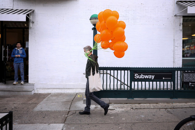 Image: Doug Hassebroek picks up balloons for his son's birthday in Brooklyn, N.Y., on April 18, 2020.