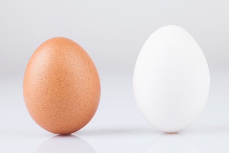 Close-Up Of Eggs Against White Background
