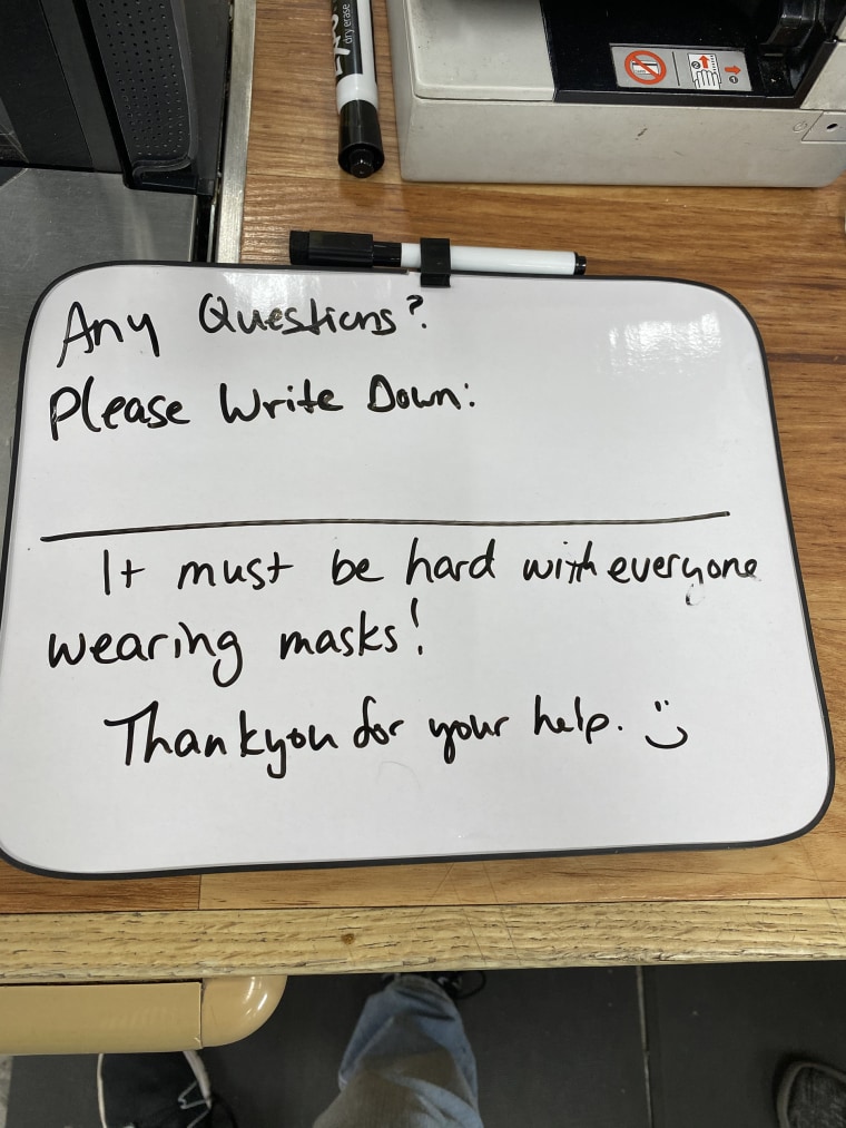 Simmons is using a white board to make sure he can still assist customers with questions while they wear masks.