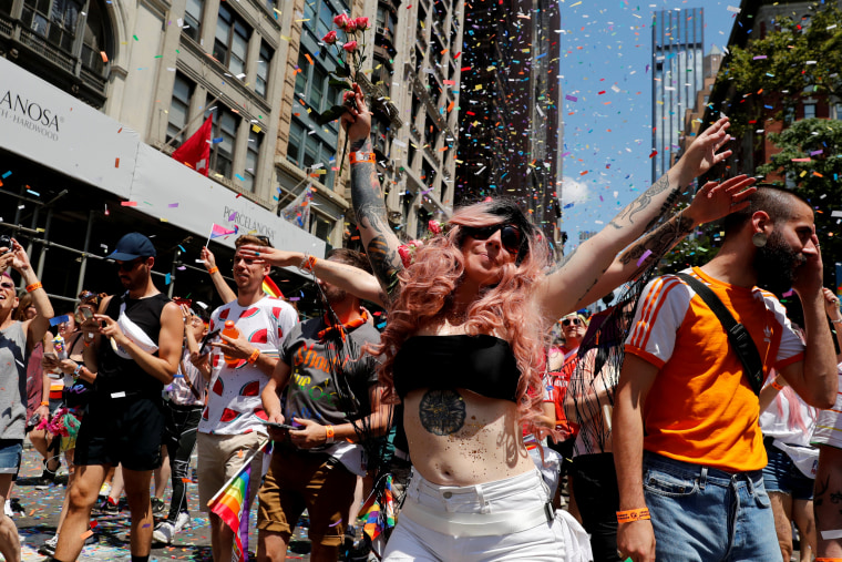 Image: Revelers dance during New York's Pride March on June 30.