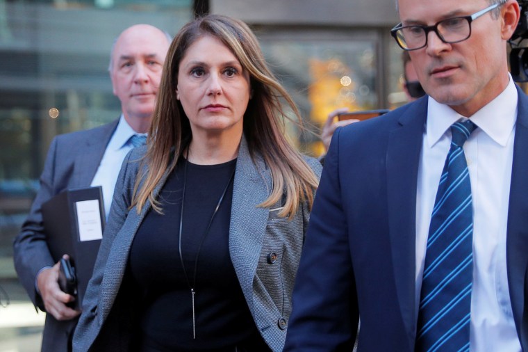 Image: Michelle Janavs leaves the federal courthouse in Boston