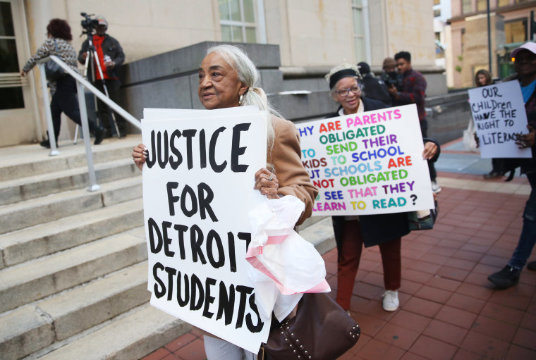 Helen Moore of Detroit leads a group of protesters at the Potter Stewart U.S. Federal Courthouse in Cincinnati